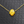 Yellow crystal pendant necklace on a textured gray background