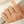 Gold ring on a finger with a blurred background