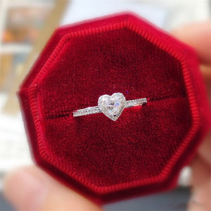 Heart-shaped diamond ring in a red velvet box