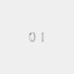 Pair of silver hoop earrings on a light gray background
