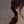 Butterfly earrings worn by a person with a blurred background