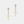 Gold cross earrings with star-shaped top elements on a light gray background