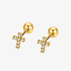 Gold cross earrings with clear gemstones on a white background