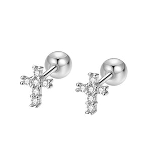 Silver cross earrings with clear stones on a white background
