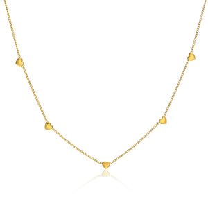 Gold necklace with heart-shaped pendants on a white background