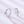 Pair of silver hoop earrings with star-shaped gemstones on a light gray background