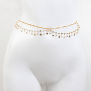 Gold chain belt with star-shaped charms on a mannequin against a white background