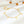 Two sterling silver bracelets with star charms, one with a gold plating, displayed on a white surface.
