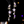 Star-shaped earrings with purple stones on a dark background