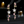 Star-shaped earrings with pink and clear stones on a dark background
