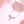 Silver necklace with star-shaped pendant on a pink background