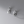 Pair of silver hoop earrings with clear gemstones on a gray background