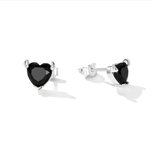 Heart-shaped black gemstone earrings on a white background