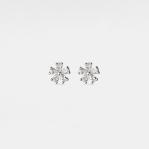 Pair of diamond stud earrings on a light gray background
