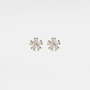 Pair of gold and clear crystal stud earrings on a light gray background