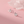 Silver swan earrings on a pink background