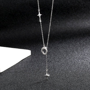 A gold-plated sterling silver necklace with a chain, featuring a star and a crescent moon design.