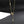 Gold necklace with star and moon pendants on a black background