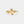 Gold ring with floral design on a white background
