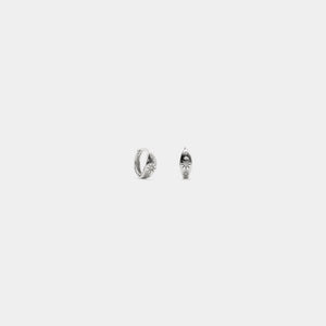 Pair of silver hoop earrings on a light gray background