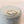 Gold ring with gemstones on a soft fabric background