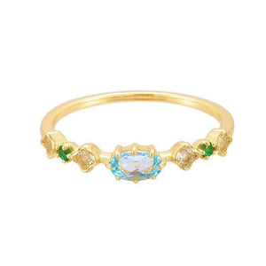 Gold ring with gemstones on a white background
