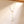 Pearl necklace with gold chain on a beige background