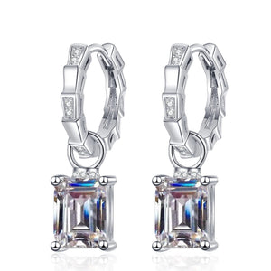 Silver earrings with rectangular gemstones on a white background