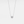 An emerald cut moissanite stone set in a silver and gold necklace with a chain.