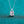 Silver necklace with a rectangular diamond pendant on a teal background