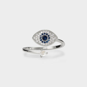 A white gold-plated sterling silver fidget spinner ring with a blue and clear cubic zirconia evil eye design