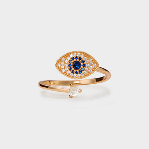A rose gold-plated sterling silver fidget spinner ring with a blue and clear cubic zirconia evil eye design