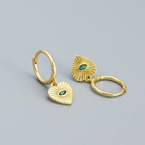 A pair of heart-shaped dangle drop hoop earrings with an evil eye design, made of solid 925 sterling silver and gold plating, displayed against a neutral background.