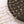Gold necklaces with various charms on a black plate