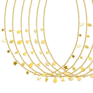 Set of gold necklaces with various charms on a white background