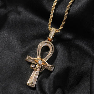 Gold Ankh pendant necklace on a black satin background