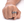 Hand wearing a silver ring with intricate design on a white background