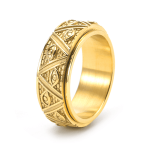 Gold ring with intricate patterns on a white background