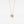 Gold necklace with a pendant on a light gray background