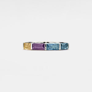 A gold-plated sterling silver band ring with multiple colored gemstone accents, arranged in a stacking style.