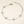 Silver bracelet with floral designs on a beige background