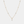 A gold-plated, sterling silver necklace with a chain design and a central four-petal flower-shaped cubic zirconia pendant.