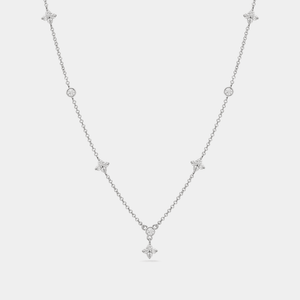 A gold-plated, sterling silver necklace with a chain design and a central four-petal flower-shaped cubic zirconia pendant.