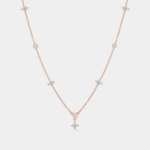 A gold-plated, sterling silver necklace with a chain design and a central four-petal flower-shaped cubic zirconia pendant.