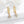 Gold hoop earrings with floral designs and diamonds on a white background