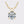 Gold necklace with a round diamond pendant on a light gray background