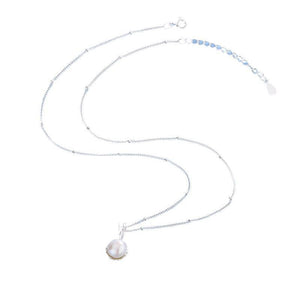 Pearl necklace with a silver chain on a white background