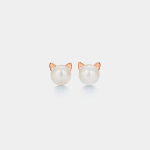 Cat ear-shaped pearl earrings on a white background