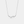 A gold-plated sterling silver necklace with a charm resembling a ginkgo leaf on a chain.