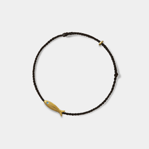 Bracelet with a fish charm on a white background